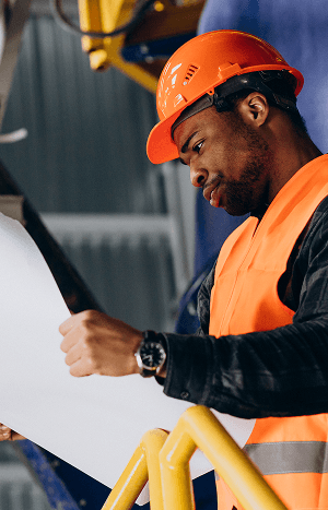 African American worker in uniform wearing safety hat